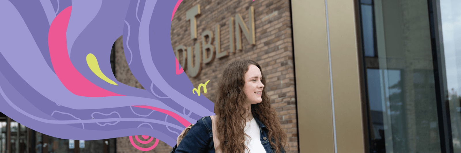 openday campus student smiling in front of TU Dublin sign