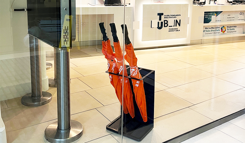 photo of 3 orange SDG 11 Umbrellas in a TU Dublin stand