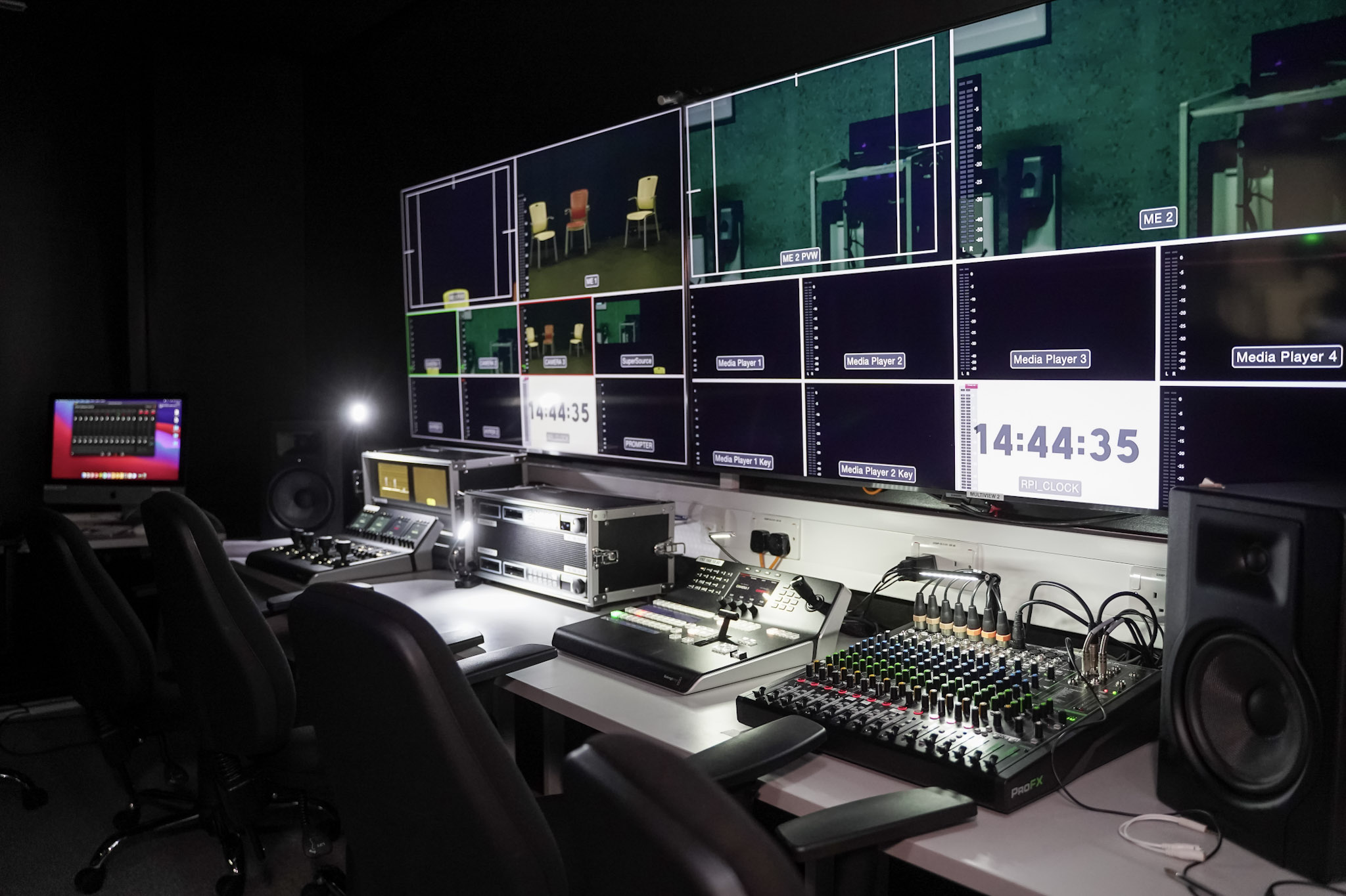 Image for An editing room with multiple screens and sound control systems