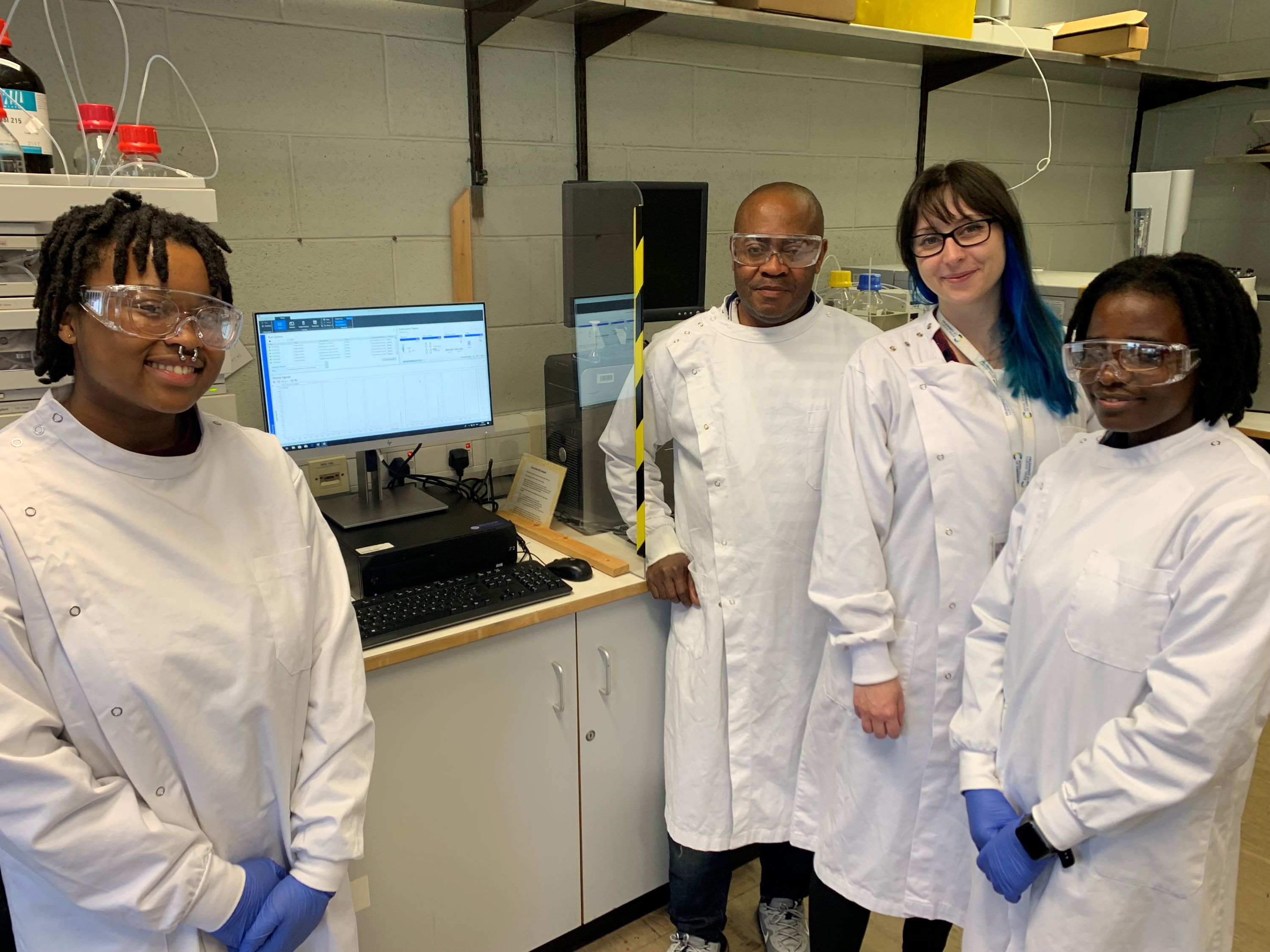 Students in lab coats.