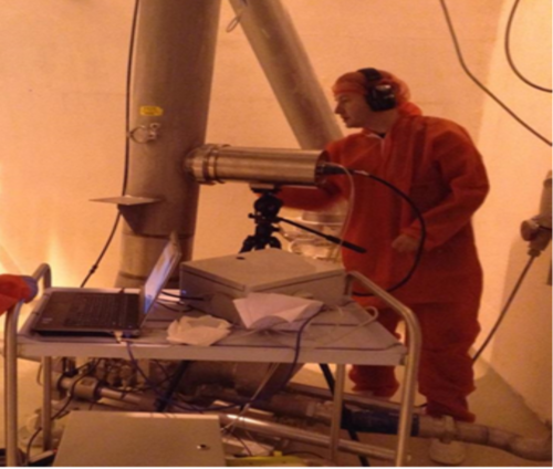 Dr. Carl Sullivan testing a prototype camera/NIR system in a factory.