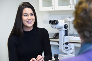 Image for researcher looking through eye testing equipment